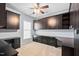Office space featuring custom cabinets and drawers for storage, complemented by a ceiling fan at 1104 Gaston Manor Dr, Durham, NC 27703