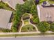 Aerial view of a meticulously landscaped community park with seating areas and beautifully designed pathways at 1104 Gaston Manor Dr, Durham, NC 27703