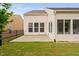 Outdoor patio with a grassy yard and fence, perfect for gatherings and enjoying the surrounding greenery at 1104 Gaston Manor Dr, Durham, NC 27703
