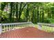 Wide shot of a wooden backyard deck and some steps at 113 Fox Run, Henderson, NC 27536
