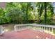 Backyard featuring a wooden deck and views of tall trees at 113 Fox Run, Henderson, NC 27536