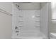 Clean white tub/shower combination with built in shelves at 113 Fox Run, Henderson, NC 27536