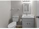 Clean bathroom featuring a white vanity, toilet, and modern fixtures at 113 Fox Run, Henderson, NC 27536