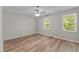 Bedroom with ceiling fan and bright windows at 113 Fox Run, Henderson, NC 27536