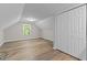 Cozy bedroom featuring light-colored wood flooring, a large closet, and plenty of natural light at 113 Fox Run, Henderson, NC 27536