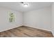 Bedroom with natural light, neutral walls, and wood-look floors at 113 Fox Run, Henderson, NC 27536