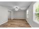 Cozy bedroom featuring durable floors, neutral paint, and bright window at 113 Fox Run, Henderson, NC 27536