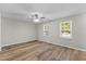 Cozy bedroom featuring durable floors, neutral paint, and bright windows at 113 Fox Run, Henderson, NC 27536