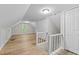 Bright bonus room with light-colored wood flooring, closet, and natural light from the window at 113 Fox Run, Henderson, NC 27536