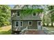 Exterior view of home's deck, backyard, and a door leading to the above-ground level at 113 Fox Run, Henderson, NC 27536