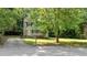 Charming two-story home with a well-manicured lawn and inviting front porch at 113 Fox Run, Henderson, NC 27536