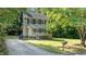 View of the front yard featuring a lush green lawn and a charming mailbox at 113 Fox Run, Henderson, NC 27536