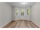 Bright room featuring new flooring and a charming bay window at 113 Fox Run, Henderson, NC 27536