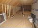 A new attic space showcasing exposed beams and rafters, providing structural integrity at 1155 Shonele Ln, Stem, NC 27581