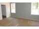 Comfortable bedroom with wainscotting walls, with two bright windows and ample closet space at 1155 Shonele Ln, Stem, NC 27581