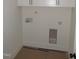 Well-lit laundry room with ample space for a washer, dryer, and storage at 1155 Shonele Ln, Stem, NC 27581