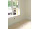 A bright room with large windows, ready for your personal touch and design ideas at 1155 Shonele Ln, Stem, NC 27581