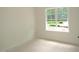 A room featuring a large window and natural light, perfect for customization at 1155 Shonele Ln, Stem, NC 27581
