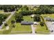 Aerial view of home with a long driveway and spacious yard on a large property at 12082 Nc 42, Fuquay Varina, NC 27526