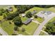 Aerial view of the property showcases its charming home and extensive acreage at 12082 Nc 42, Fuquay Varina, NC 27526