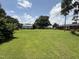 Lush backyard offering ample space for recreation, featuring an outbuilding and mature trees at 12082 Nc 42, Fuquay Varina, NC 27526