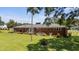 Expansive backyard view showing lawn, landscaping, and brick home exterior at 12082 Nc 42, Fuquay Varina, NC 27526