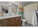 Beautiful bathroom showcasing a dual sink vanity and sleek shower and bath combo at 12082 Nc 42, Fuquay Varina, NC 27526