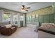 Charming Bedroom with unique floral wallpaper and a cozy reading chair at 12082 Nc 42, Fuquay Varina, NC 27526