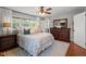 Bright bedroom with large window, features a comfortable bed and stylish dresser at 12082 Nc 42, Fuquay Varina, NC 27526