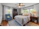Cozy bedroom featuring a comfortable bed, sitting chair and an abundance of natural light at 12082 Nc 42, Fuquay Varina, NC 27526