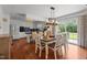 Open concept kitchen and dining area with ample seating and natural light from the patio doors at 12082 Nc 42, Fuquay Varina, NC 27526