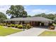 Charming brick home with a well-manicured front yard and attached carport at 12082 Nc 42, Fuquay Varina, NC 27526