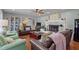 Well-decorated living room featuring hardwood floors, a fireplace, and comfortable seating at 12082 Nc 42, Fuquay Varina, NC 27526