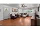 Cozy living room featuring hardwood floors, neutral tones, and ample seating at 12082 Nc 42, Fuquay Varina, NC 27526