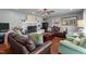 Inviting living room with a fireplace, hardwood floors and lots of comfortable seating at 12082 Nc 42, Fuquay Varina, NC 27526
