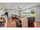 Cozy living room with hardwood floors, a fireplace, and lots of natural light at 12082 Nc 42, Fuquay Varina, NC 27526