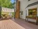 Spacious back deck with a dining table and chairs, providing a relaxing outdoor space for enjoying the greenery at 128 Castlewood Dr, Cary, NC 27511