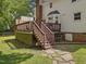 Backyard view featuring a deck, stairs, and exterior home, providing a comfortable outdoor living space at 128 Castlewood Dr, Cary, NC 27511