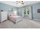 Bedroom features carpet flooring, ceiling fan, and a window at 128 Castlewood Dr, Cary, NC 27511