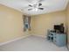 Bedroom features neutral walls, carpet flooring, ceiling fan, and a window at 128 Castlewood Dr, Cary, NC 27511