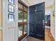 Stylish front door with decorative glass and interior view of the foyer and living area at 128 Castlewood Dr, Cary, NC 27511