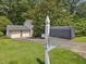 Charming home with a two-car garage, lush lawn, and mature trees at 128 Castlewood Dr, Cary, NC 27511