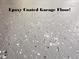Epoxy-coated garage floor with a durable and aesthetically pleasing finish, perfect for car enthusiasts and home improvement lovers at 128 Castlewood Dr, Cary, NC 27511