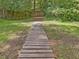 Wooden path or walkway leading through the property's outdoor area at 128 Castlewood Dr, Cary, NC 27511