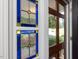 Detailed view of decorative stained glass sidelight in the home's foyer, adding charm and character at 128 Castlewood Dr, Cary, NC 27511