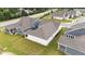 A well-maintained lawn features a covered patio and wrought iron fence that borders neighboring properties at 1319 Richfield Oaks Dr, Fuquay Varina, NC 27526