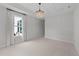 Bright bedroom featuring an ornamental light fixture at 1319 Richfield Oaks Dr, Fuquay Varina, NC 27526