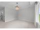 Bright bedroom with a coffered ceiling and chandelier at 1319 Richfield Oaks Dr, Fuquay Varina, NC 27526