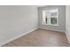Bright bedroom with natural light and wood-look flooring at 1319 Richfield Oaks Dr, Fuquay Varina, NC 27526