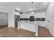 Modern kitchen features stainless steel appliances and white cabinets at 1319 Richfield Oaks Dr, Fuquay Varina, NC 27526